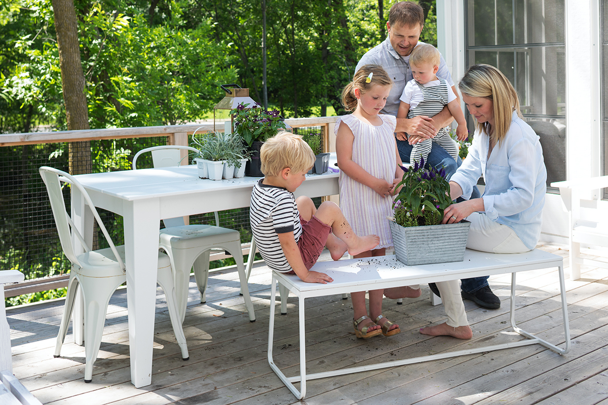 This AMEK home was designed for an active family. Here, the family enjoys some bonding time on the deck.