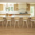 AMEK Bloomington kitchen remodel with natural accents large kitchen island custom cabinetry gold lights