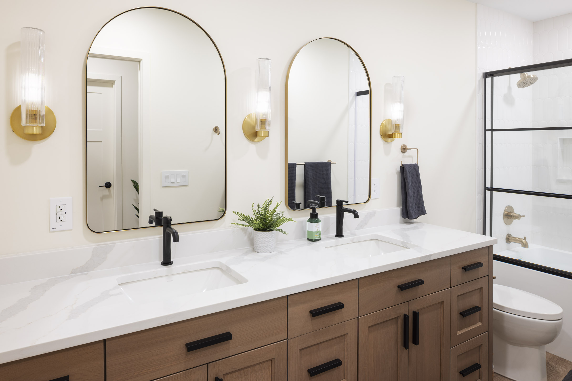 AMEK Edina lower level bathroom gets a refined upgrade.