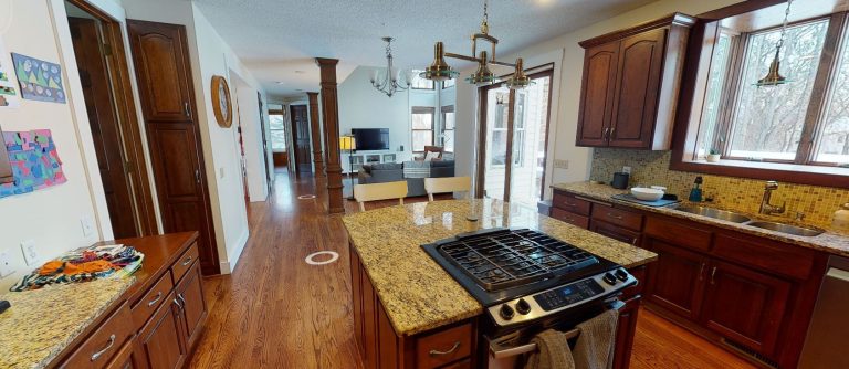 AMEK Mahtomedi Kitchen Before 2022 MP Kitchen to LR Angle 768x334 1