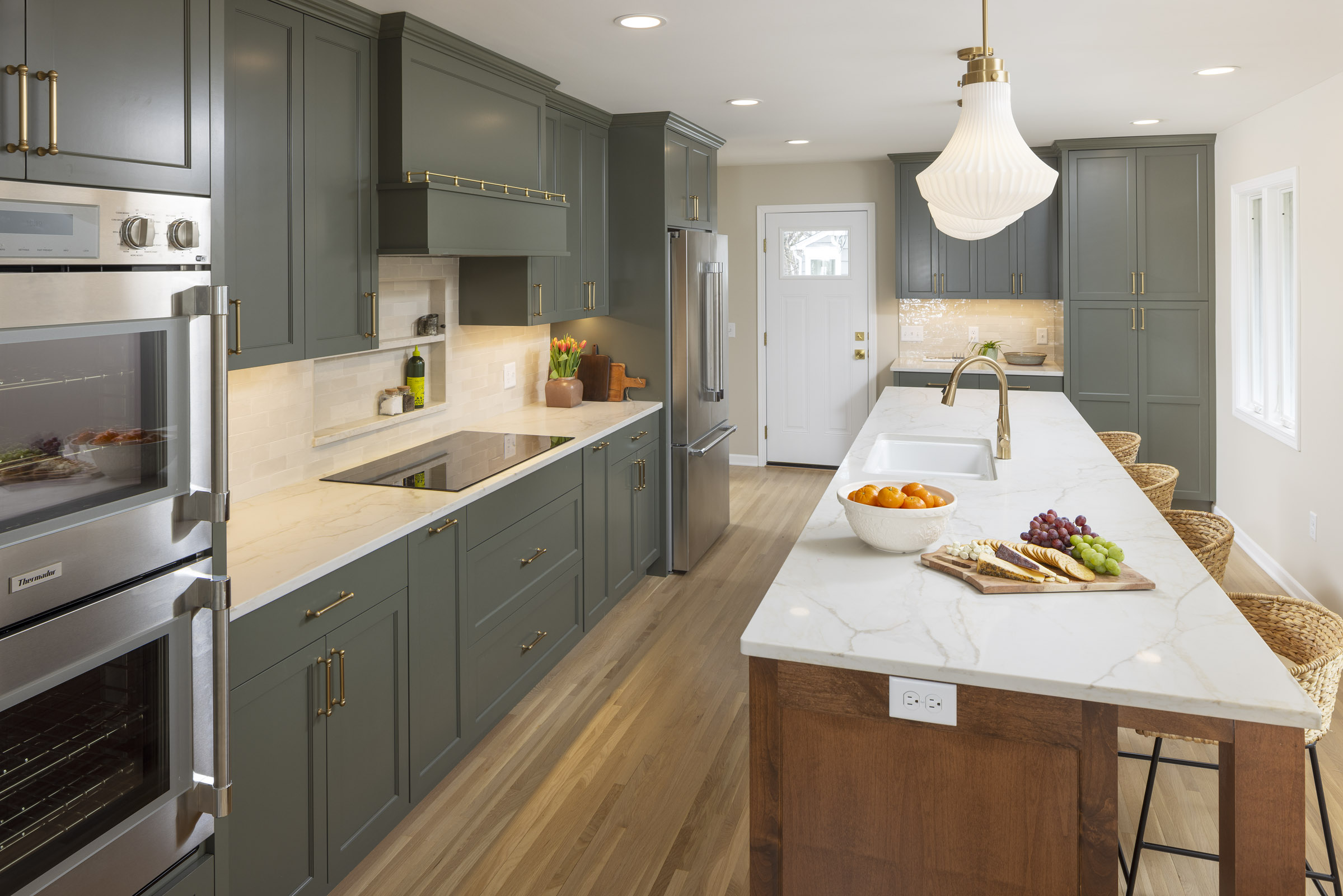 Our Portfolio 2 Richfield Kitchen with two-toned cabinetry, wood floors, arched doorways, rambler